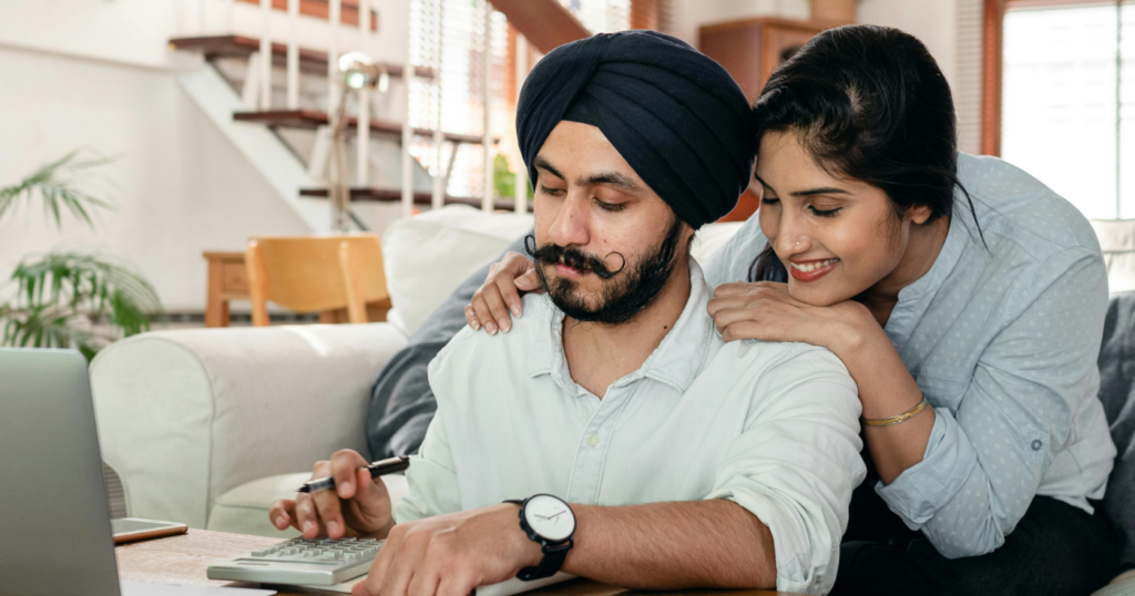 How Can A Landlord Report Tenants Rent Payments To Credit Bureaus Mobile - Image of male and female landlords reviewing rent payments.
