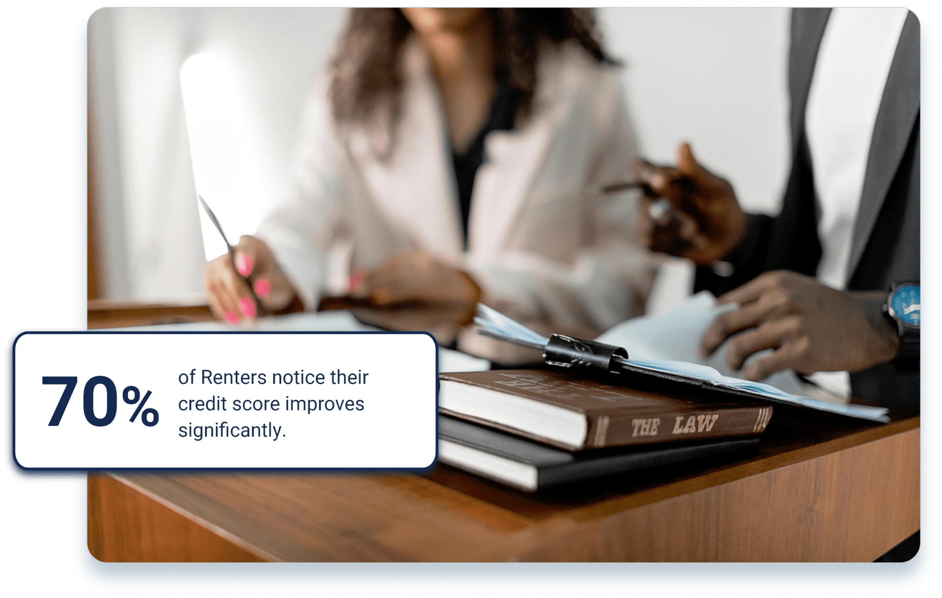 Image of male and female Georigia Landlords at desk reporting tenant rent payments to the Credit Bureaus