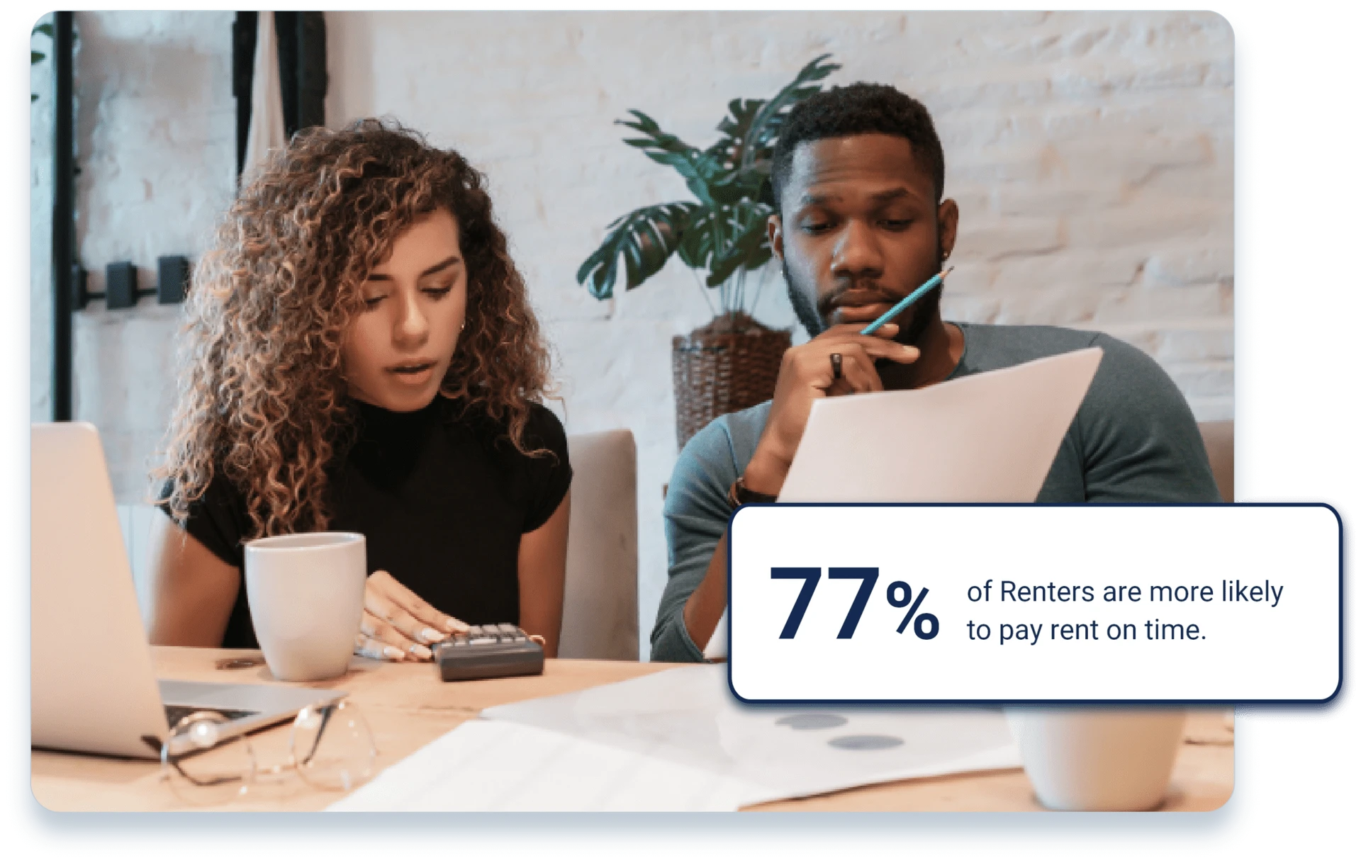 Male and female Georgia Landlords at desk with computer and coffee reviewing list of tenants not paying rent