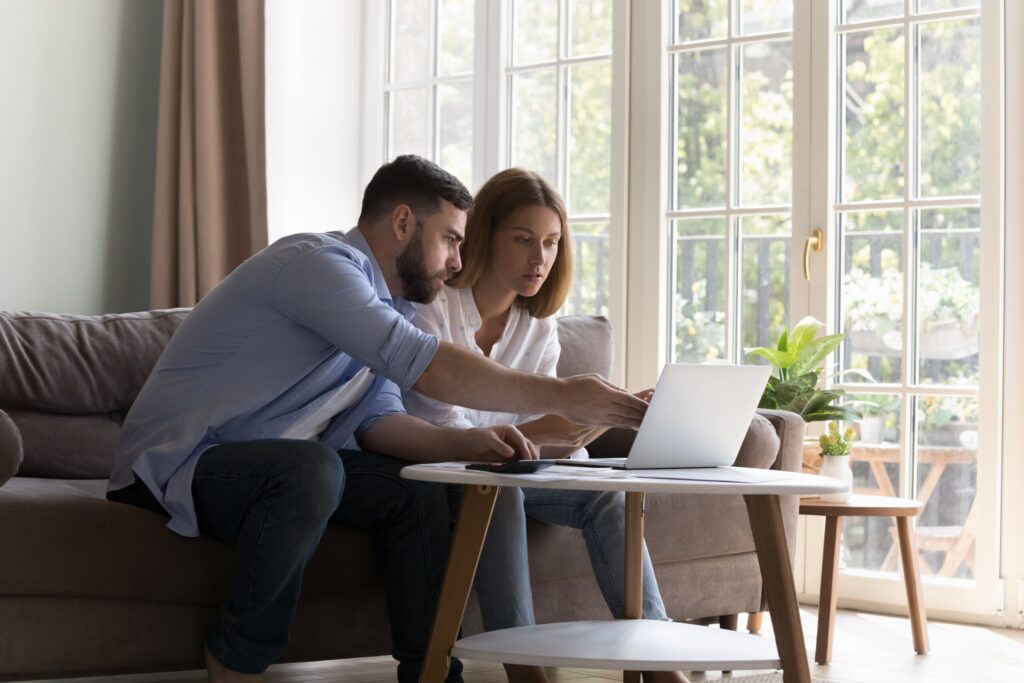 Canadian couple comparing Canadian Rent Reporting providers