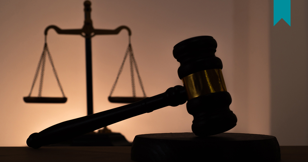 A courtroom gavel and scales of justice, representing the importance of structure, documentation, and accountability in preventing legal disputes.