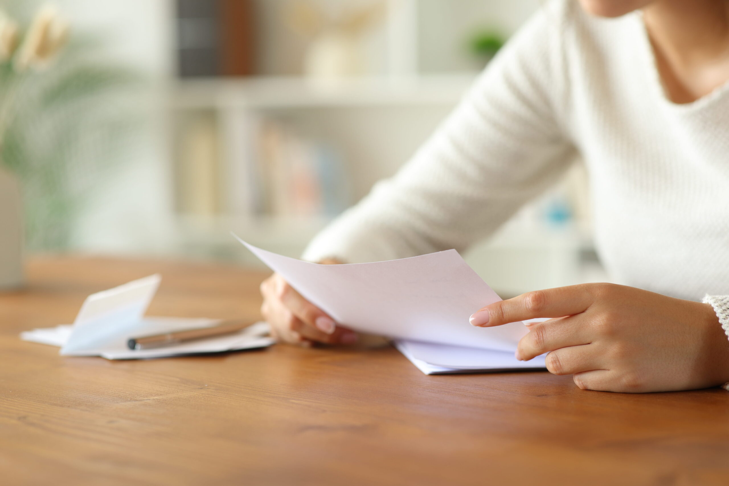 Female Tenant reviewing credit report.