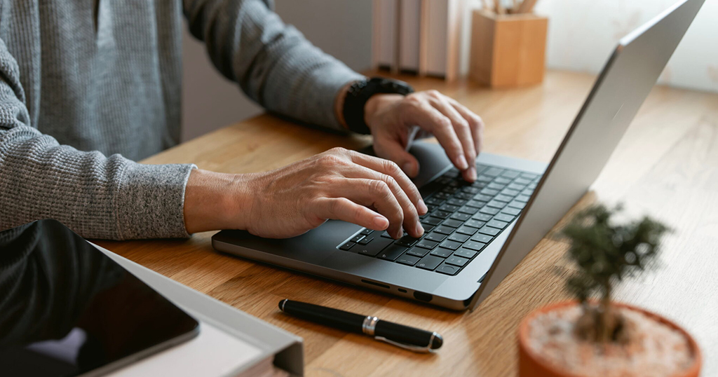 Male Landlords hands reporting rent payments to FrontLobby